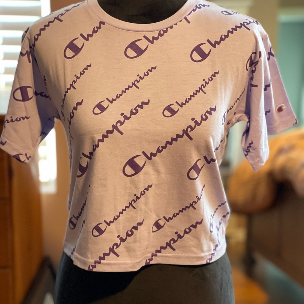 Champion, size M, light purple, short sleeve t-shirt.